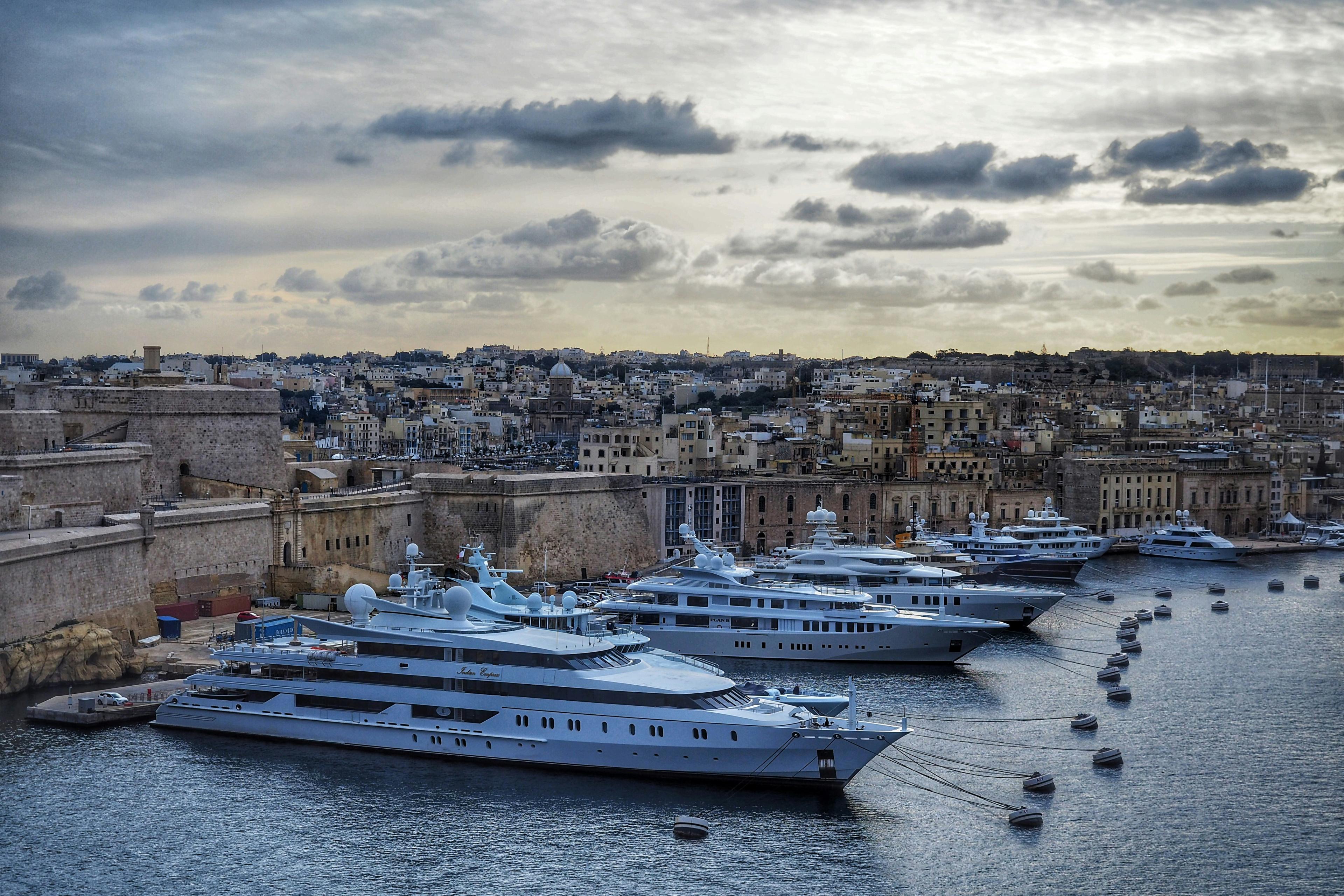 Superyacht moored in Newport Harbor with Newport Beach skyline