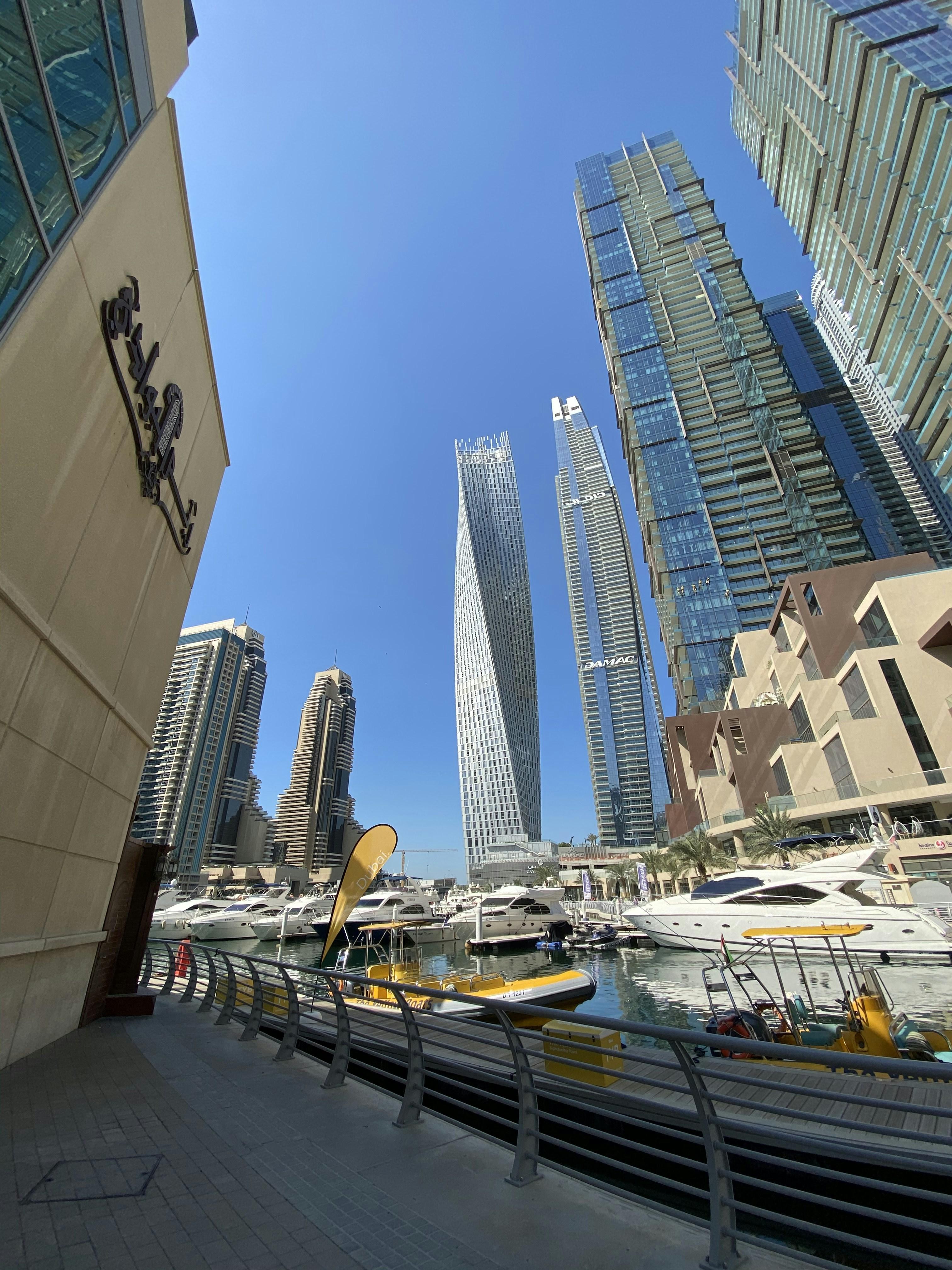 New luxury motor yacht at a Newport Beach marina with clear blue skies