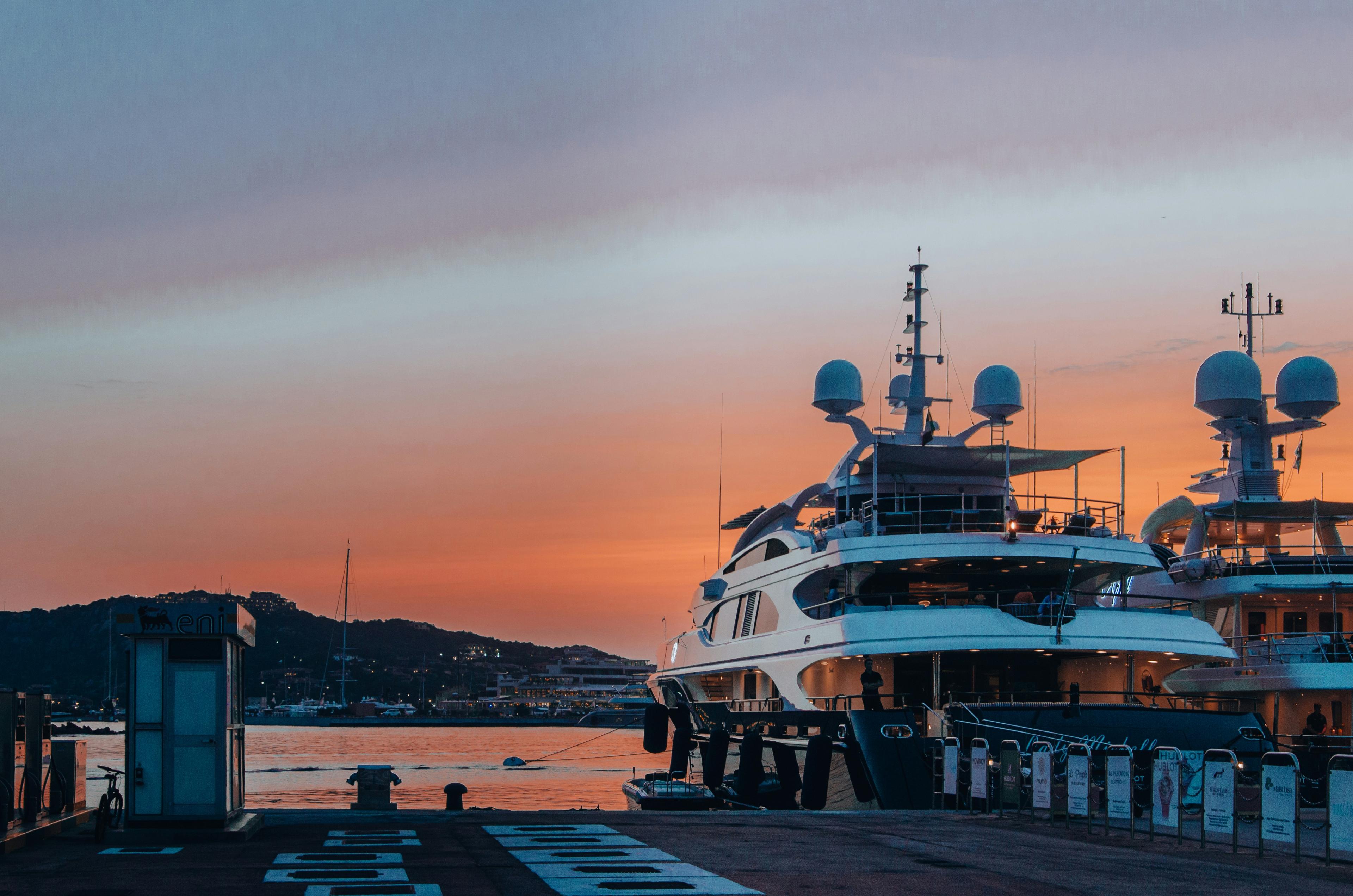 Luxury superyacht moored in Newport Harbor at sunset