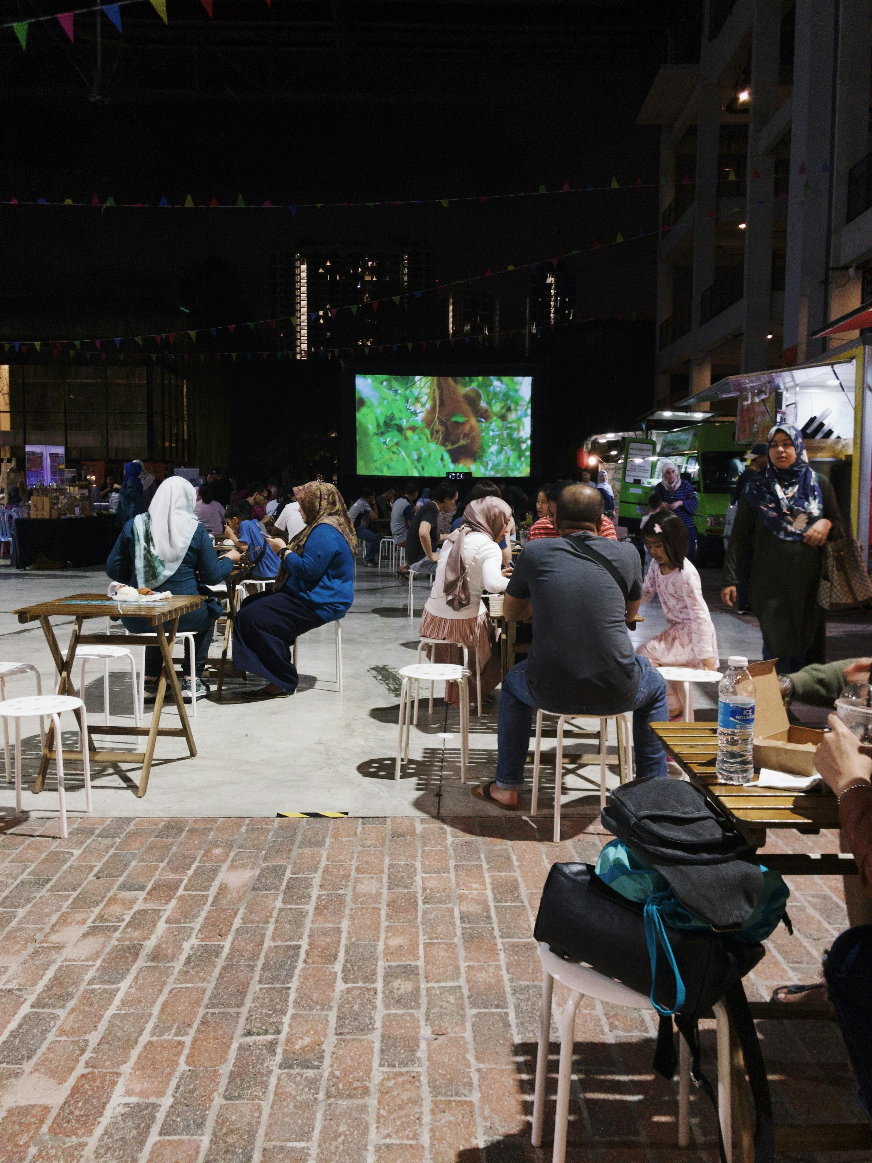 Newport Beach Film Festival outdoor screening with audience watching a film at night