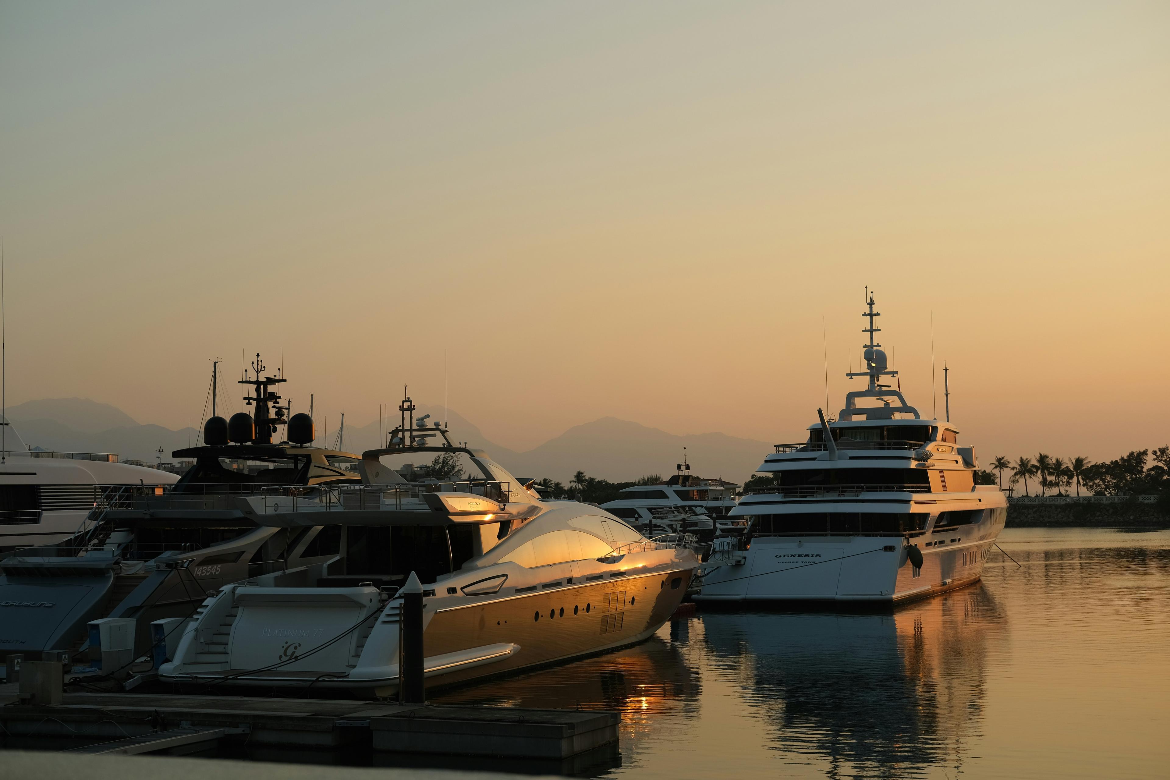 Luxury superyacht moored in Newport Harbor at golden sunset