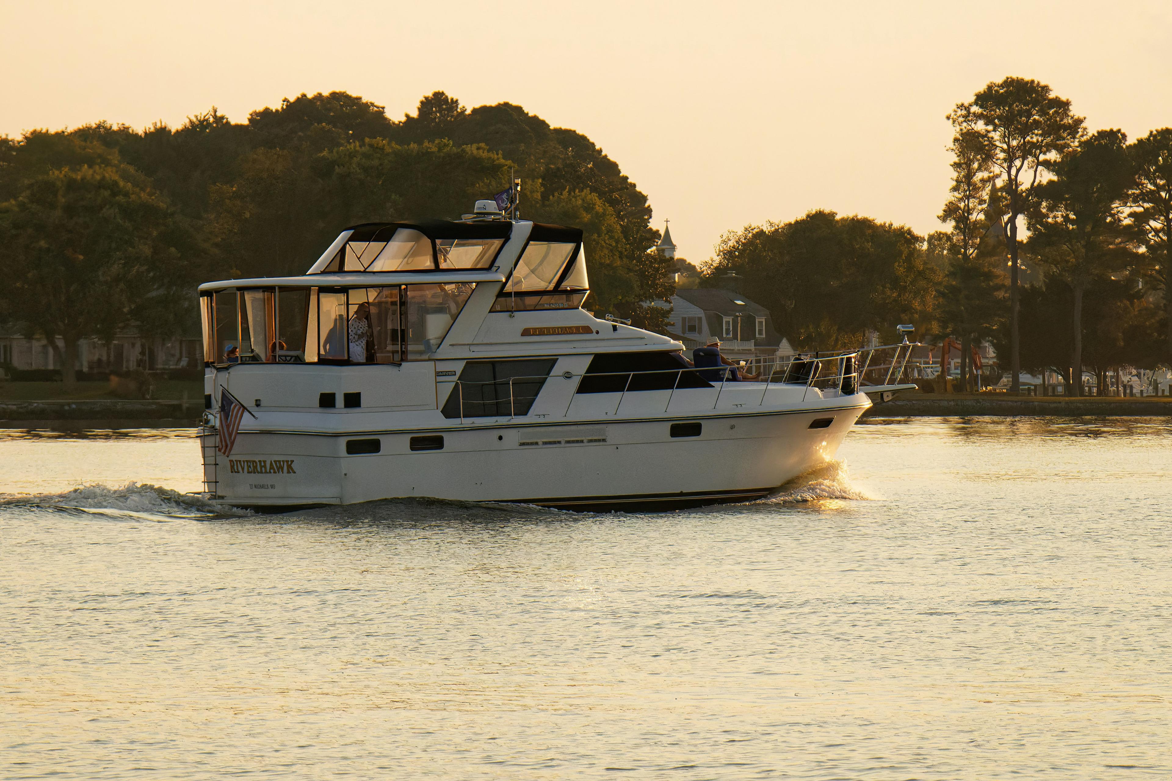 Newport Harbor at golden hour with luxury yachts and calm water