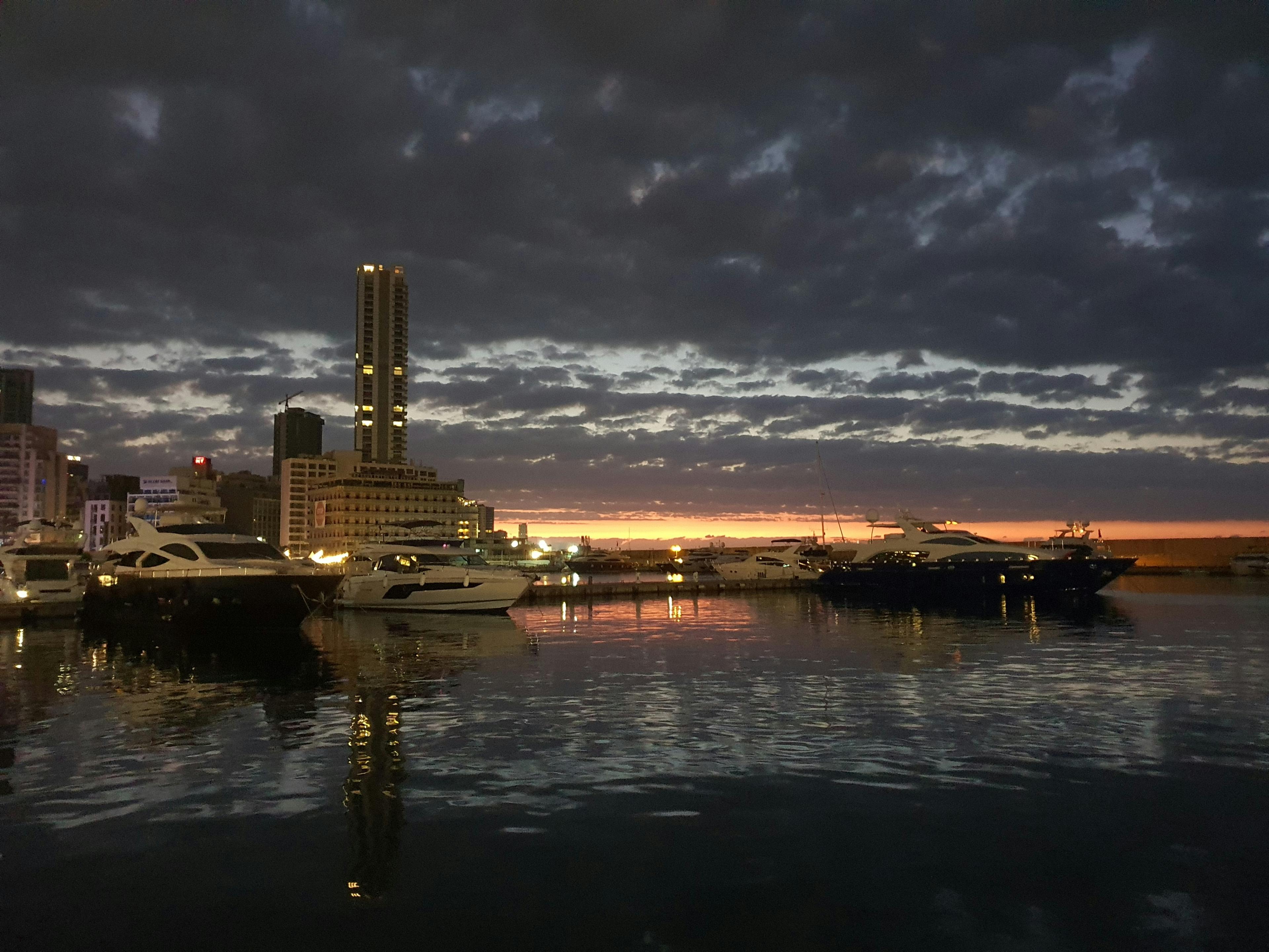 Luxury superyacht moored in Newport Harbor at sunset
