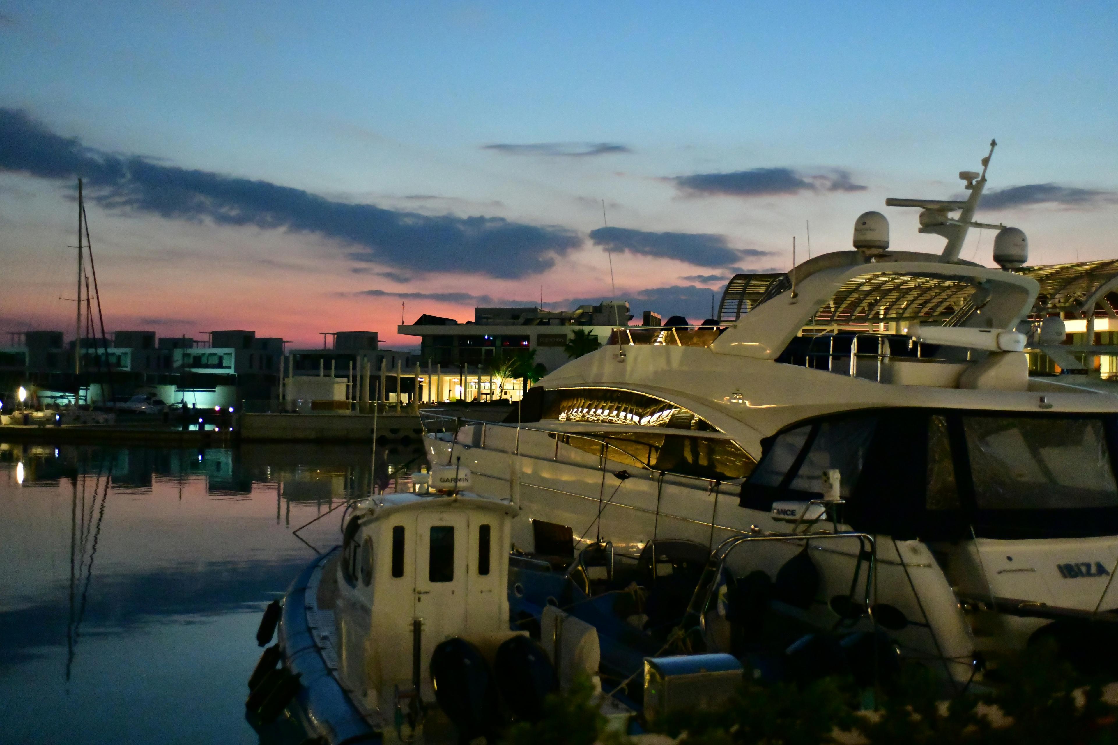 Azimut luxury yacht moored at a marina at sunset