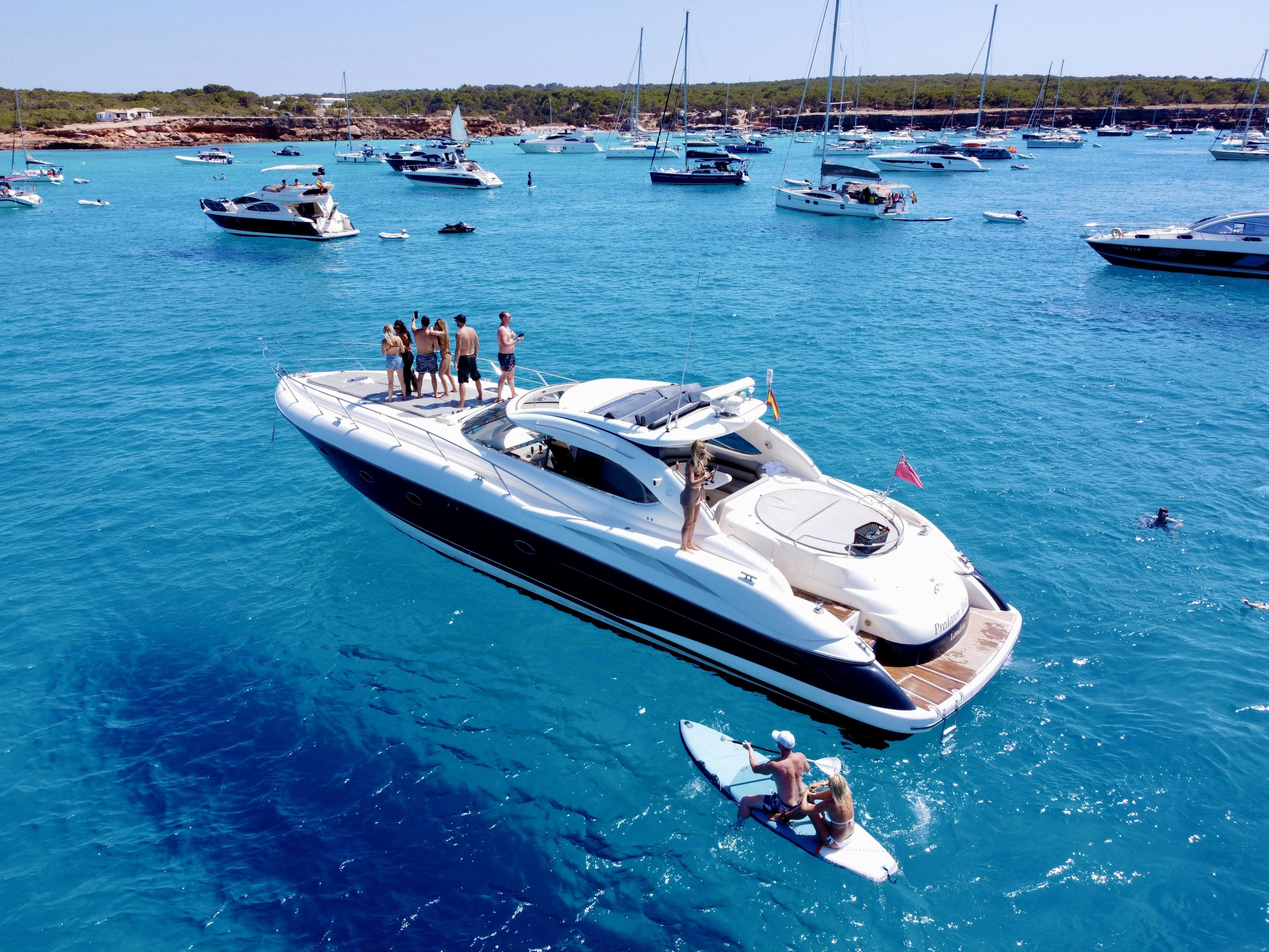 Freedom Boat Club member enjoying a powerboat on Newport Harbor on a sunny day