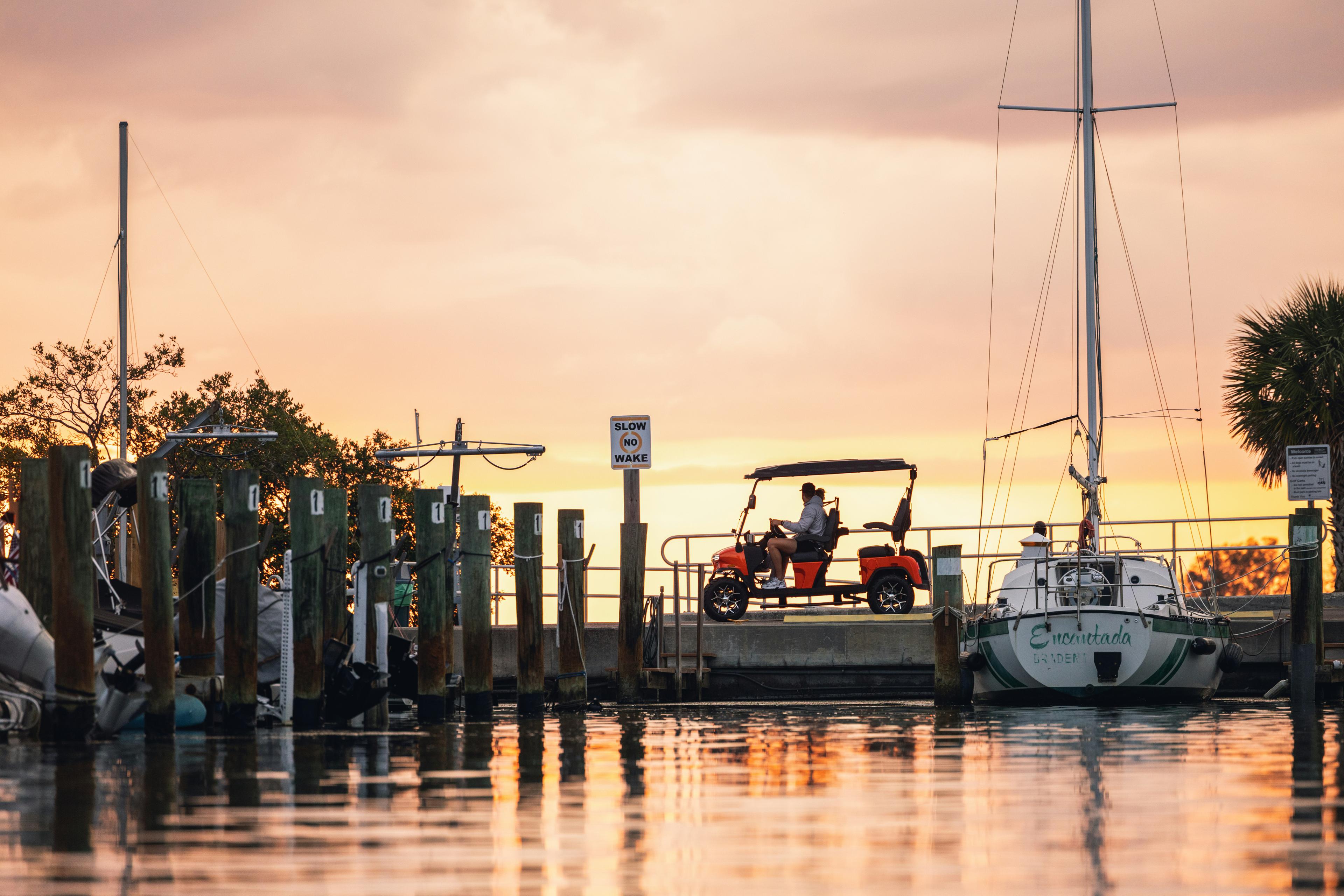 Duffy electric boat with passengers enjoying a sunset harbor cruise