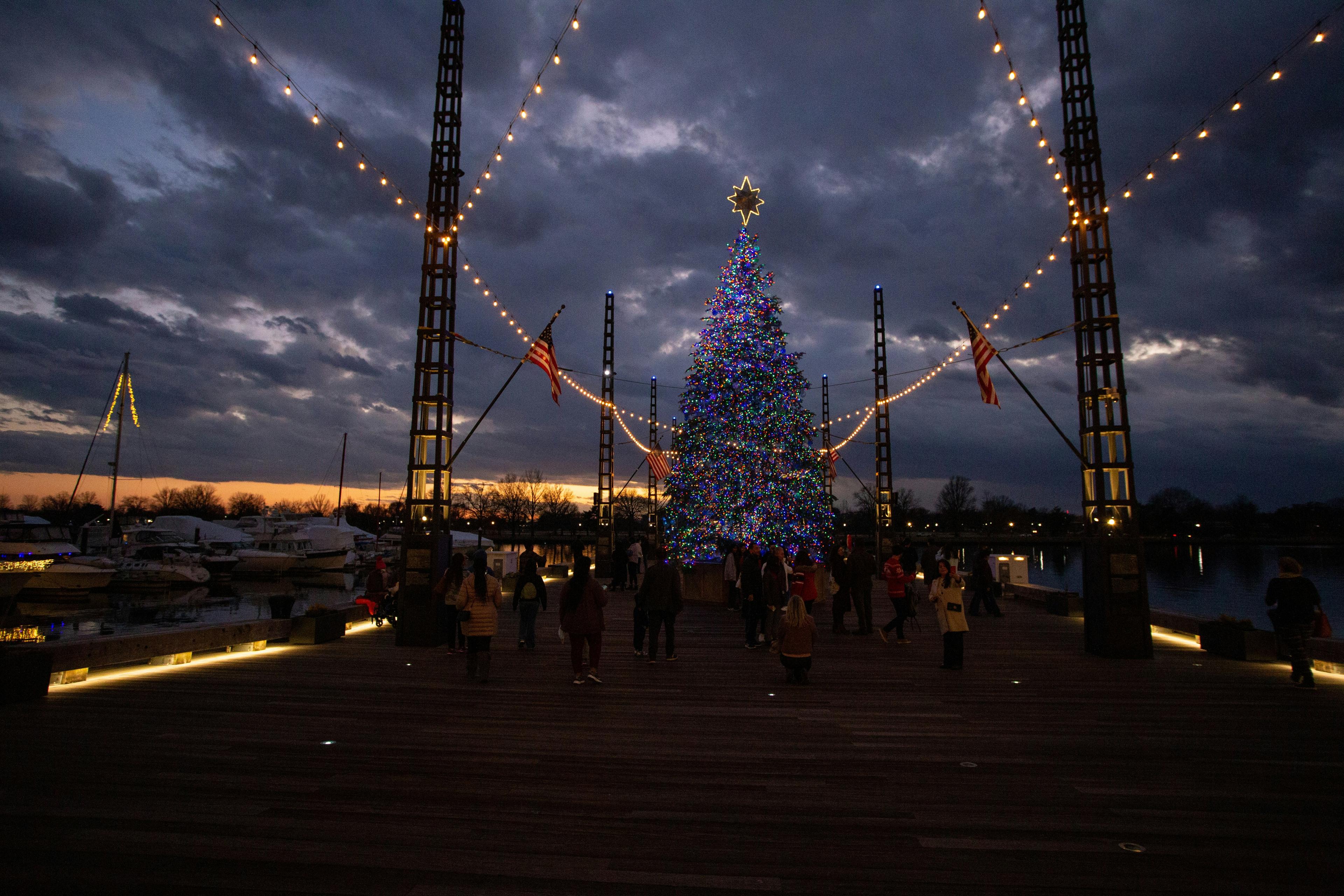 Newport Beach Christmas Boat Parade with brilliantly illuminated and decorated boats in Newport Harbor at night